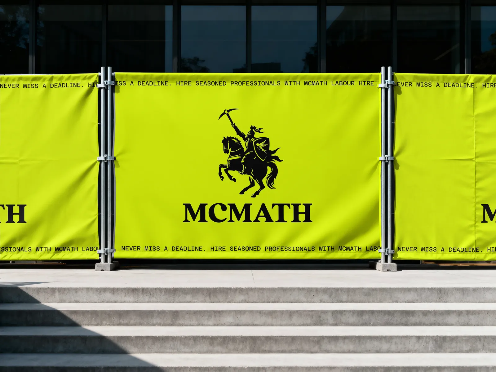 Lime site fencing banners with the black McMath mark centred between repeating tagline bands